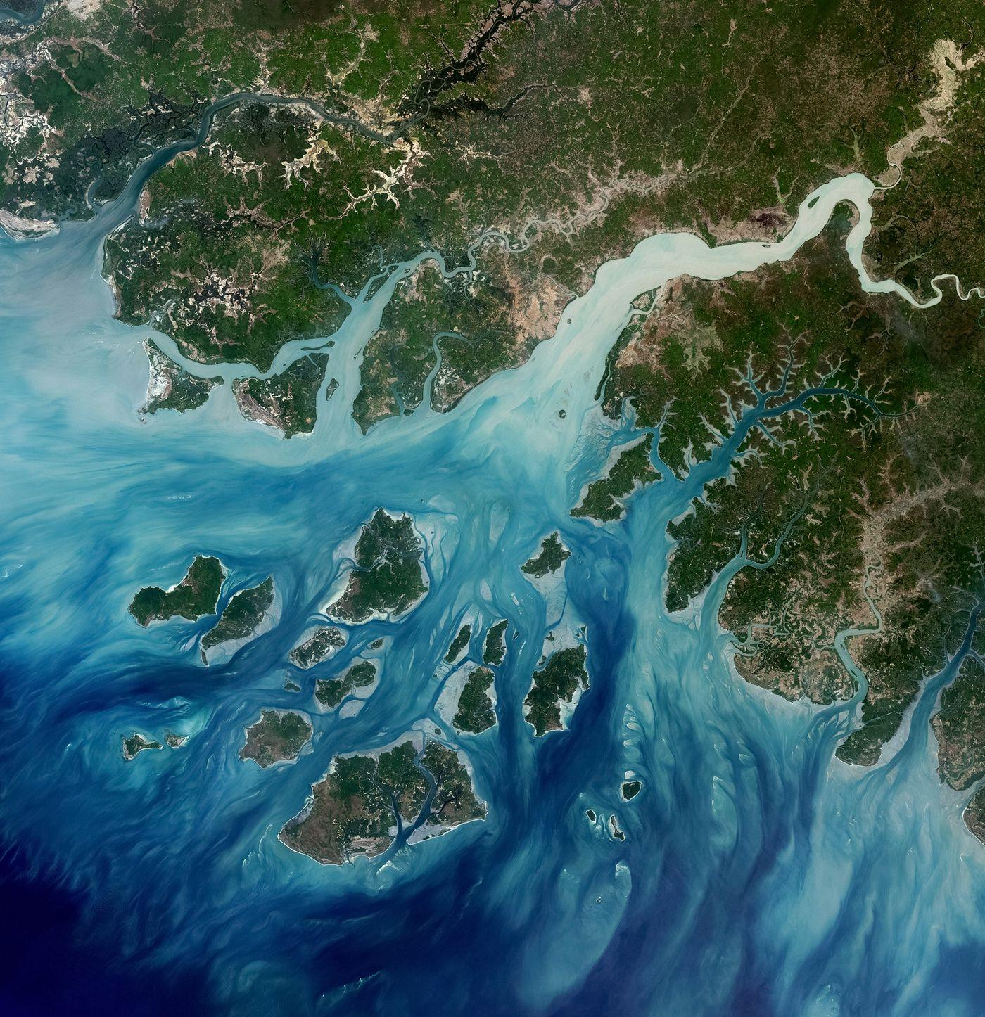 A delta seen from orbit, turquoise channels dividing low islands into a lattice of distinct patches of water
